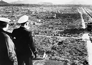 Ruins Prints: A Royal Navy officer and rating looking across the centre of damage at Hiroshima several