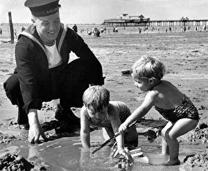 00095 Prints: Royal Navy sailor A Ryder enjoys his time on leave as he spends the day with his two sons