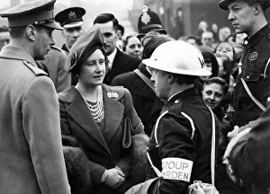 Royal visit to Salford - King George VI & Queen Elizabeth talking to a group warden in