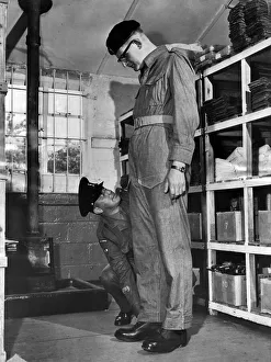 Stores Prints: The RQSM (Regimental Quarter Master Sergeant Major) William Barnes gets the tape measure