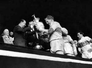 Rugby League Cup Final 1956. St. Helens v. Halifax. Prescott of St. Helens receives cup
