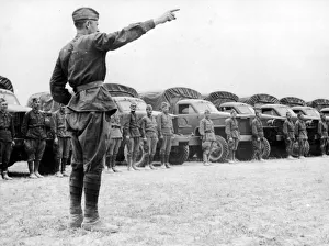 Ammunition Prints: A Russian officer instructing his drivers as they take over Allied vehicles to control
