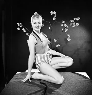 Shorts Prints: Ruth Calvert seen here modelling the latest 1959 springtime fashions posing with blossom