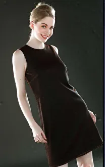 Ruth Kemmer model wearing a dark brown dress hair tied up 1996