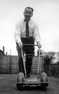 Smokes Prints: Sacked Manchester City manager George Poyser pictured doing a spot of gardening at his