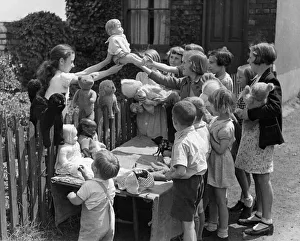 Toys Prints: Sacrifice is this schools lesson, for here the children are offering their toys for sale