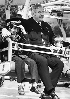 Fairground Prints: In safe hands of the law... Jason Lawson (left) aged 10 and Scott Marsdon aged 3