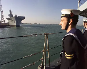 Core46 Prints: A sailor from HMS Birmingham stands to attention as the ship passes HMS Ark Royal in