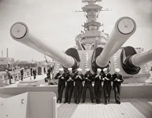 US sailors enjoying a tub of ice cream after their ship the US Iowa docks at Portsmouth