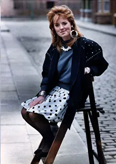 1980s Fashion Prints: Sally Ann Matthews Actress sitting on chair in Coronation Street February