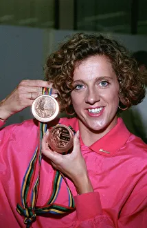 Athlete Prints: SALLY GUNNEL HOLDING HER GOLD AND BRONZE MEDALS WON AT THE 1992 OLYMPICS ON RETURN TO