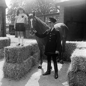 Sally Jones (9) from Bucks, pictured with the horse she named Warrior and PC Tom TucKer