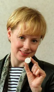 Sally Whittaker and May 1998 Coronation Street actress holding an old 50p