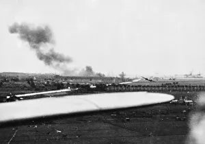 A salvo of bombs bursting on the concrete runway of Schipol Aerodrome, Amsterdam