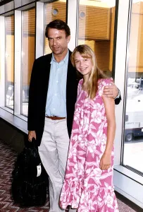 Sam Neill Actor with Jurasic Park star Amanda Richards arrives at Heathrow Airport