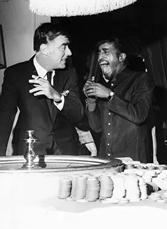 Roulette Prints: Sammy Davis Jnr Actor / Singer with Peter Lawford at gambling tables at the Pair of Shoes
