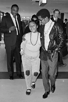 00077 Prints: Sammy Davis Jnr arriving at Heathrow with Egey Rhodes the daughter of his band leader