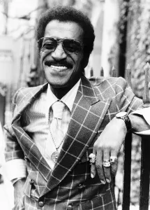 Sammy Davis Jnr - October 1976 Actor / Singer leaning on fence