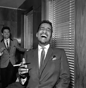 00077 Prints: Sammy Davis Jnr at a press reception in Soho cinema showing slips of his new film Robin