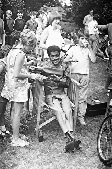 Sammy Davis Junior signing autographs whilst on location of One More Time