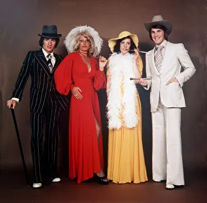 SANDY JARDINE AND KENNY DALGLISH WITH THEIR WIVES at a party in the 1970s hat suit