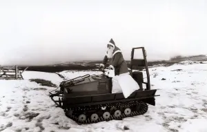00202 Prints: Santas Claus - Father Christmas - December 1987 chooses a snowmobile instead of