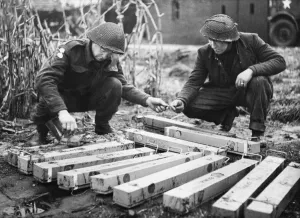 Sappers Prints: Sappers of the 51st Highland Division make safe these anti-personnel mines removed