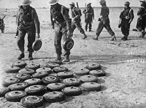 Sappers Prints: Sappers of a South African Division clearing and making safe enemy mines in the Bardia