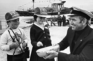 Fair Prints: Sarah and Anthony Hanlon offer their congratulations to the lifeboat coxswain John
