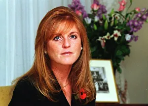 Pearl Prints: Sarah Ferguson, Duchess of York At home in November 1997 wearing black dress with Poppy