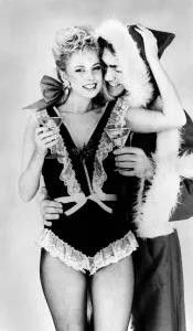 Knickers Prints: Satin and lace are Santas favourites. Man dressed as Santa with woman wearing