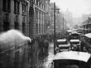 A scene of chaos and confusion as firemen turn the hose on a demonstration of unemployed