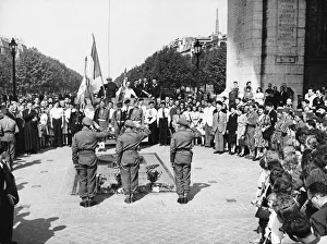 A scene at the grave of Frances Unknown Soldier at the Arc de Triomphe as A. F. P. U