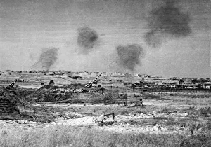 A Scene in Malta as heavy guns of an anti aircraft battery open fire on raiding enemy