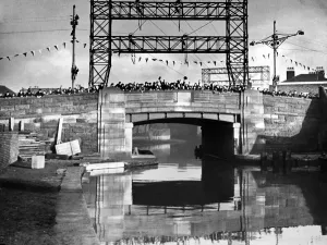 Bunting Prints: A scene of people on a bridge celebrating the coronation of King George VI