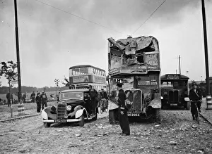 01466 Prints: Scene showing considerable damage to the front of a bus following an air raid by