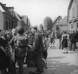 Holland Prints: Scene in the town of Ede. Holland, following the entry and liberation of the town by