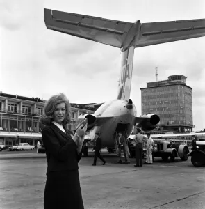 Aeroplane Prints: Scenes at Manchester Airport. Information desk assistant Margaret Delaney, 22