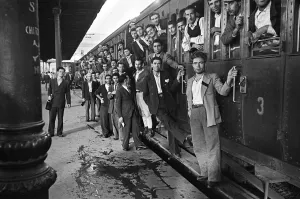 Local People Prints: Scenes in Naples, southern Italy showing men arriving at the railway station