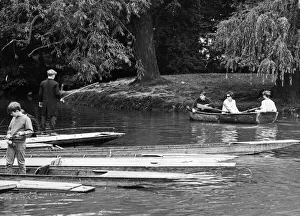 Boating Prints: Scenes on the River Cam in Cambridge showing people enjoying a spot of fishing on their