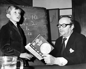 School boy 9 year old Sebastian Head explains the new currency to presenter Jack de Manio