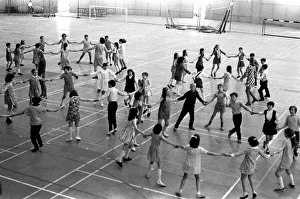 School children take part in an end of school year dance at the Lightfoot Stadium in