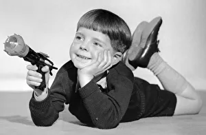 Imagination Prints: Schoolboy seen here playing with a Dan Dare ray gun 2nd December 1957