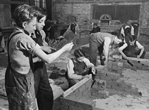01422 Collection: Schoolboys build little houses. More than a 100 schoolboys from aged 13 are 1st