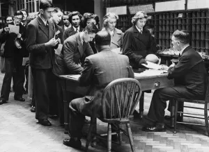 Schoolboys and girls enrolling for Post Office work in Reading. 15th December 1942