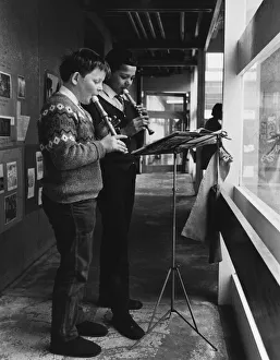 Lessons Prints: Two schoolboys playing the recorder during a music lesson at the Vittoria primary school