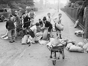 Schoolboys from Yardley Primary School help council workmen fill sandbags just prior to