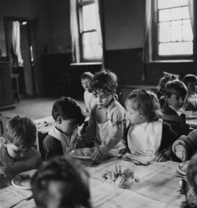 One of the schoolchildren helping to serve school dinners at the London County