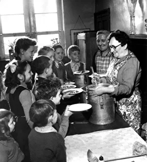 Catering Prints: Schoolmistress Jean Cambell serving 17 children their school dinner