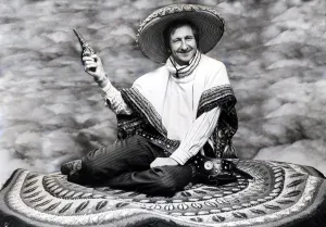 National Dress Prints: Scotland football manager Ally MacLeodwearing sombrero and ponchositting on a magic